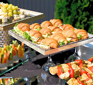 Hi-tea catering menu featuring gourmet finger foods, desserts, and tea selections for events.